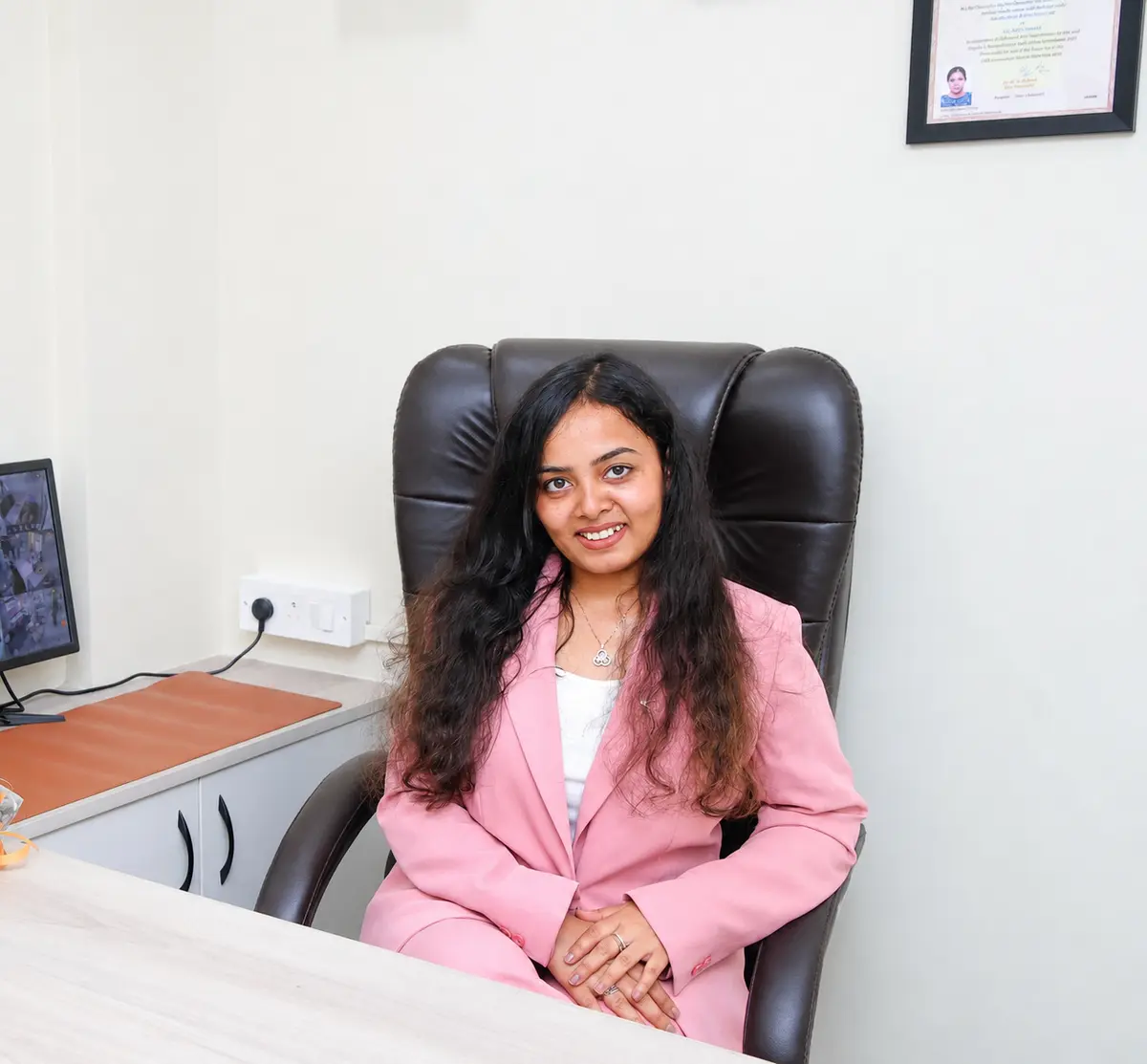 Dr. Smahi Sakshi seated in her consultation room at House of Enamel